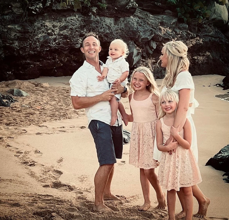 Summer and David Thompson with their four kids on the beach